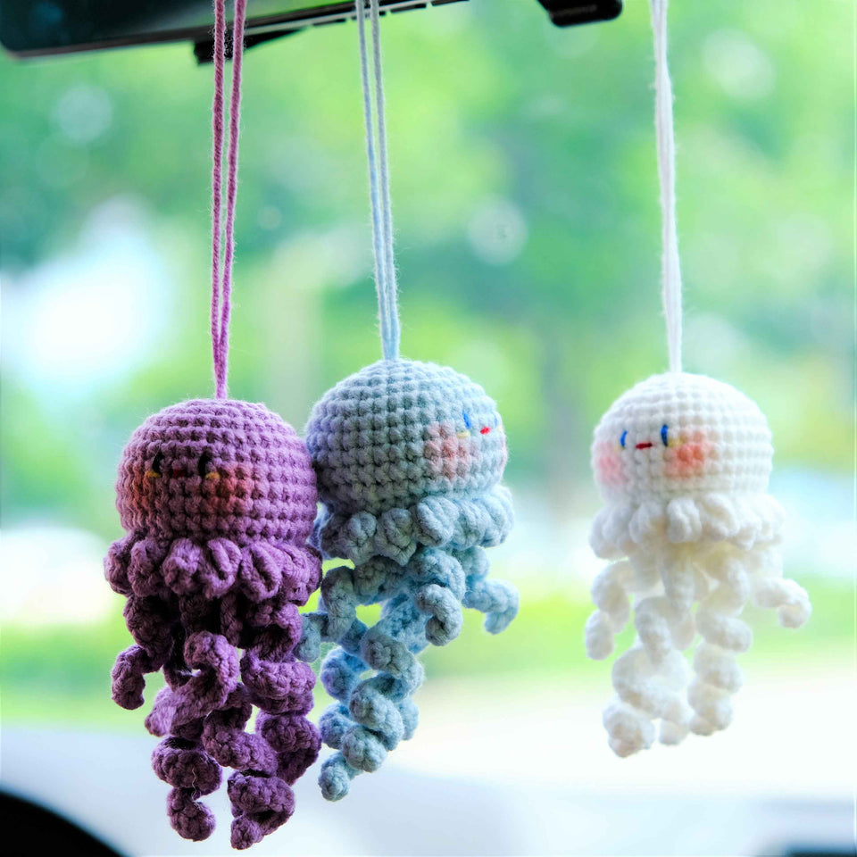 Handmade crochet jellyfish car mirror hanging accessory in soft pastel colors