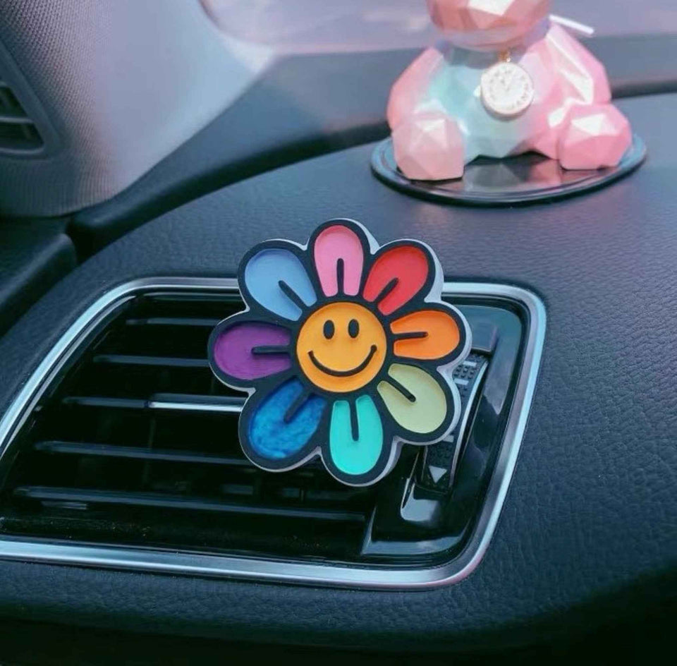 Cute plaster car scent clips with smiley and daisy options