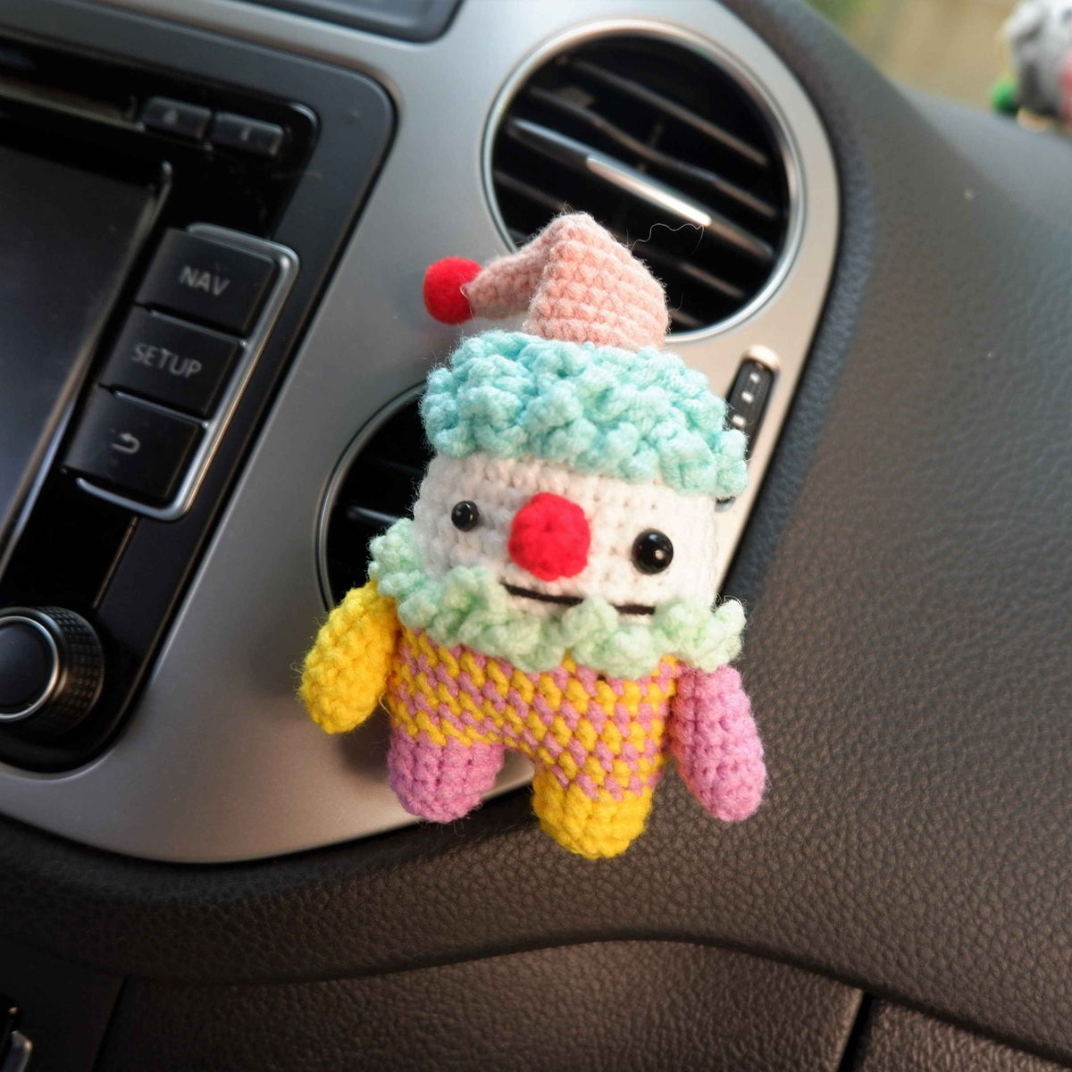 Spooky-cute clown diffuser clip for car vents